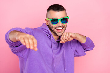 Photo of young cheerful guy have fun eyeglasses dancer clubber isolated over pink color background