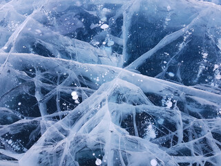 winter abstract background blue ice with white cracks. High quality photo