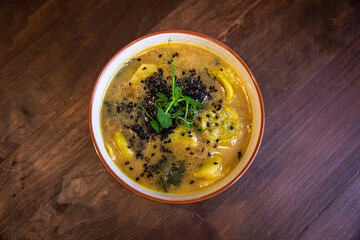 detox soup in bowls on rustic wooden board, Clean eating, dieting, vegan, vegetarian, healthy food concept