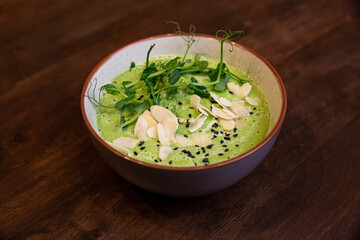 detox soup in bowls on rustic wooden board, Clean eating, dieting, vegan, vegetarian, healthy food concept