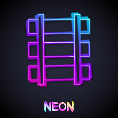 Glowing neon line Railway, railroad track icon isolated on black background. Vector