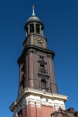 Fototapeta na wymiar Tower of St. Michael's Church, Hamburg, Germany, (German: Hauptkirche Sankt Michaelis, colloquially called Michel)