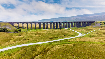 Fototapeta premium An aerial view towards the Ribblehead Viaduct, Yorkshire, UK on a summers day