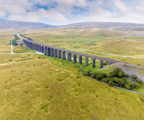 An aerial view of the Ribblehead Viaduct, Yorkshire, UK on a summers day