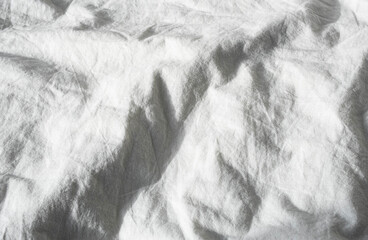 Texture white cotton fabric. Abstract cloth creases of satin.