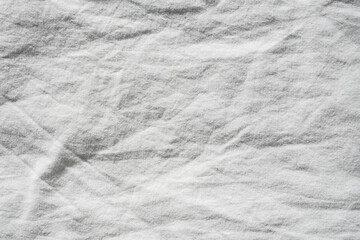 Texture white cotton fabric. Abstract cloth creases of satin.
