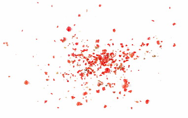 Ground red peppercorns, crushed pepper pile isolated on white background and texture, top view