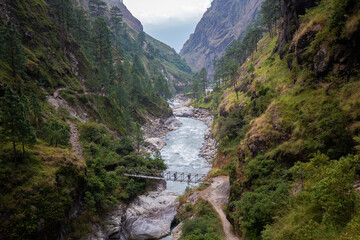 View over a valley with a bridge during Manaslu Circuit Trek