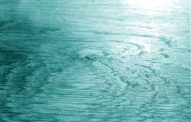Old oak board texture as background with blur effect in cyan tone.