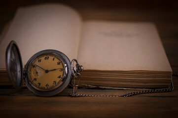 Old vintage books and a watch