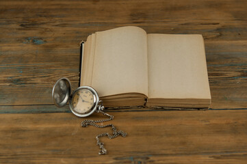 Old vintage books and a watch