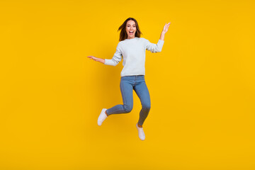 Fototapeta na wymiar Full size photo of cheerful joyful happy woman jump up good mood enjoy weekend isolated on yellow color background