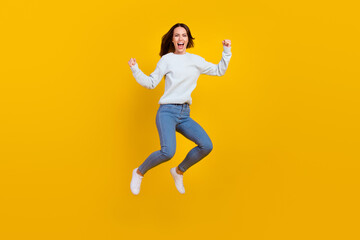 Fototapeta na wymiar Full body photo of cheerful crazy happy woman jump up winner sale news isolated on yellow color background