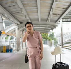 Senior woman travel tired and have neck pain.