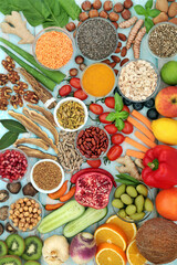 Vegan and vegetarian food for immune system support with vegetables, cereals, fruit, medicinal herbs and spice. Health food high in antioxidants, anthocyanins, lycopene, fibre, omega 3, protein.