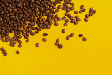 coffee beans on a yellow background, other grains scattered around, concept - 462481079
