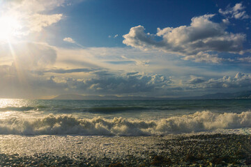 picturesque seascape before sunset, sunlight, shine, storm clouds