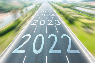 Number of 2022 to 2026 on empty straight asphalt road