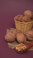 closeup photo of a walnut seed in wooden bowl. Food that is good for brain and lower risk of heart disease.