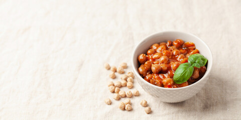 Piquant boiled  chickpeas in a sauce with pepper and prunes. Vegetarian or vegan food. Copy space