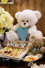 A candy bar with sweets with teddy bears for a baby 