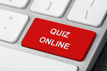 Fototapeta premium Red button with text QUIZ ONLINE on modern computer keyboard, closeup view