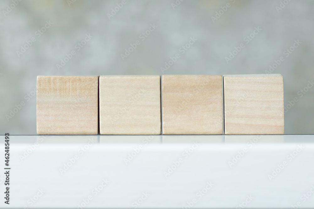 Poster four blank wooden block cubes on a white background for your text. free space for business concept t