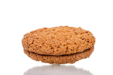 One fresh oatmeal cookie, close-up, isolated on white.
