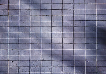 Fototapeta na wymiar Light rays on wall tiles texture background