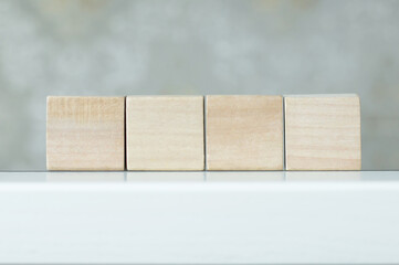 Four blank wooden block cubes on a white background for your text. free space for business concept template and banner.