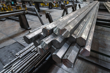 A bundle of hexagonal metal bars, steel mill products