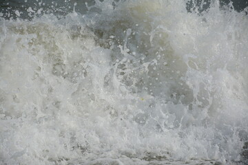 Sea waves close-up on a cloudy day