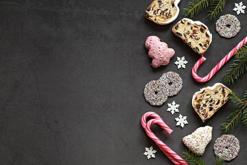 Christmas festive background with German traditional Stollen,  cookies and candy. Overhead view, copy space