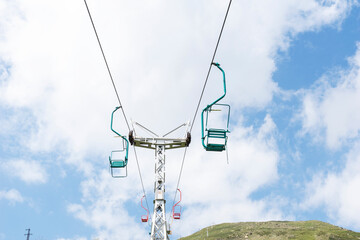 View of old single chairlift on sky background. Copyspace.
