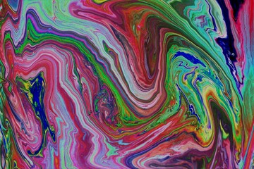 Abstract multicolored marble background. Acrylic paint mixes freely and creates an interesting pattern. Bright saturated shades. Background for the cover of a laptop, laptop.