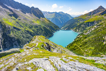 Naklejka na ściany i meble Beautiful alpine walley with azure blue water of Speicher Zillergrundl dam, Zillertal Alps, Austria