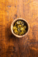 Fototapeta na wymiar Pickled sliced jalapeno. Green jalapeno peppers in bowl.