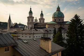 Fototapeta na wymiar Skyline of Salzburg city with Cathedral in summer on a cloudy day at sunset, Austria