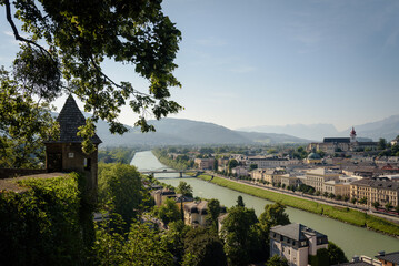 View of Salzburg, the river Salzach and the mountains from the old Kapuzinerberg wall on a sunny summer day, Austria