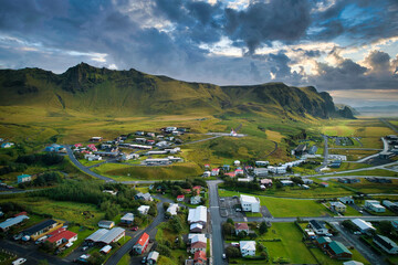 Small Icelandic town in tranquil valley by the ocean