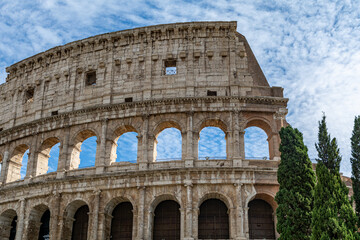 Obraz premium Detail of the Colosseum (Coliseum) in Rome, Italy. It is the main tourist attraction of Rome. Ancient Roman architecture and ruins of Rome in sunlight. 
