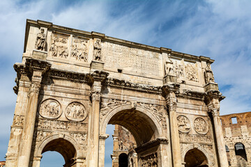 Fototapeta na wymiar Low angle view of the triumphal Arch of Constantine next to the Colosseum in Rome.