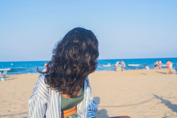 Young indian woman happy in the beach