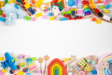 Baby kids toy frame. Many colorful educational toys on white background. Top view, flat lay, copy space for text