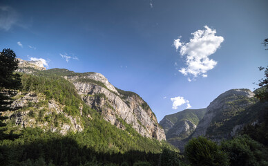 Clouds passing over monte pedido mountains and river
