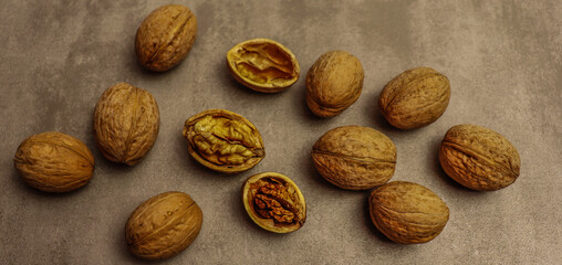 Brown table background with walnuts for food banner design