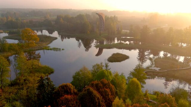 Aerial view of Kirkilai karst lakes and lookout tower in the sunny fall morning