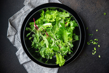 salad leaves mix fresh herbs petals vitamin aperitif fresh ready to eat meal snack on the table...