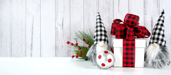 Web banner. Christmas farmhouse theme background backdrop styled with gift with buffalo plaid bow...