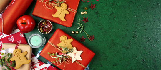 Christmas holiday framed border banner. Christmas red and green theme gift wrapping top view blog hero header creative composition flat lay. Negative copy space.